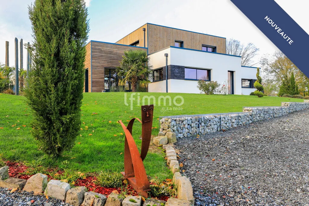 Superbe Maison Moderne sur Terrain Paysagé de 7030 m² – 603 000