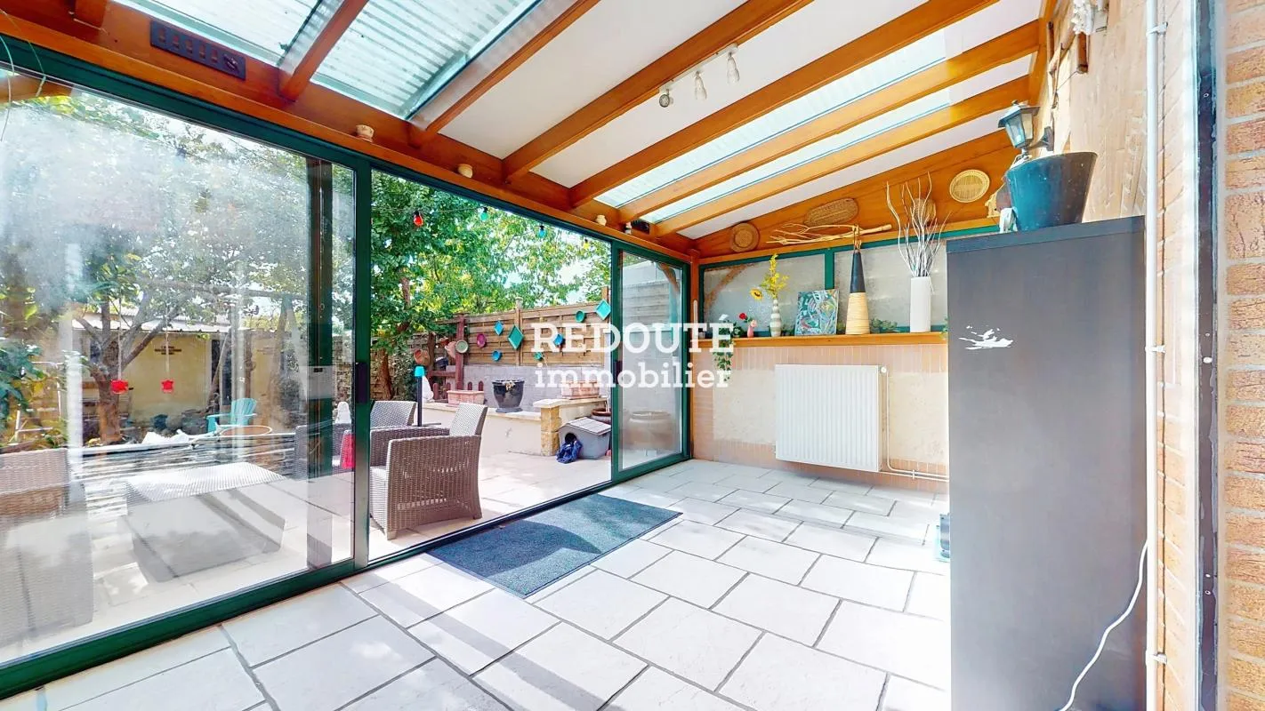 A vendre: Maison avec véranda, jardin, cave, et dépendance