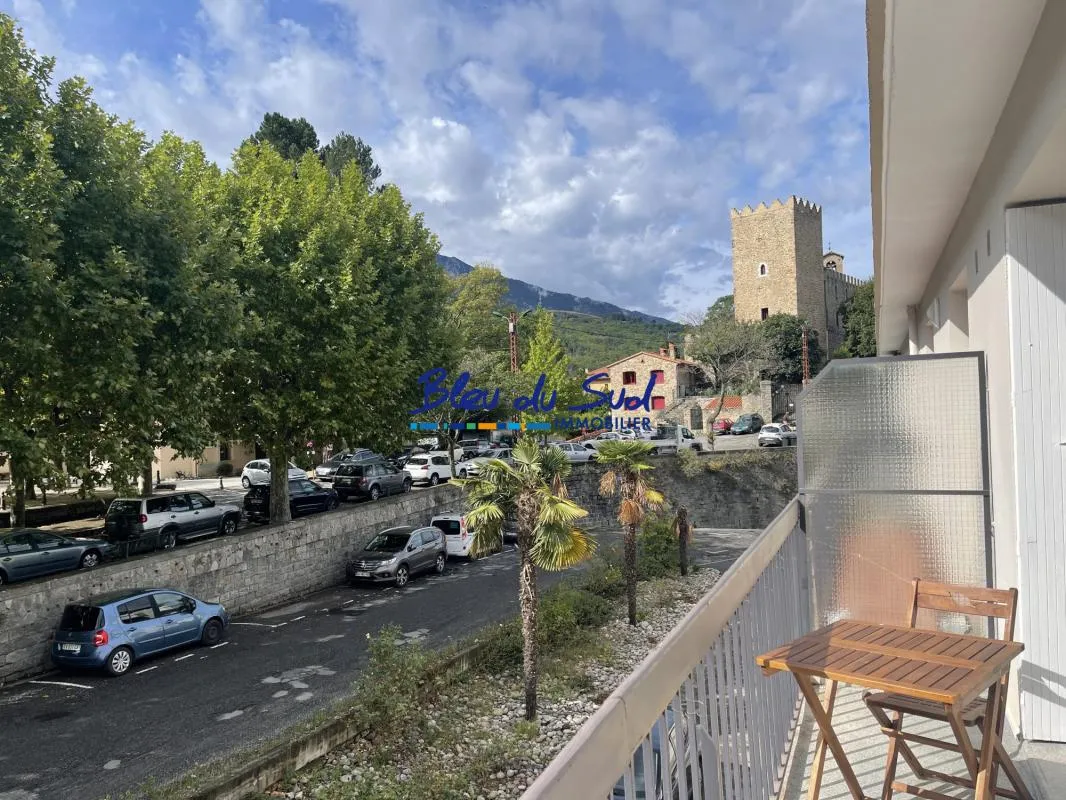 Appartement T2 avec balcon, place de parking couverte et cave