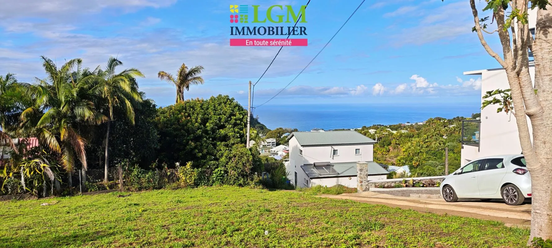 Lot A terrain constructible proche centre Petite-île, avec vue mer